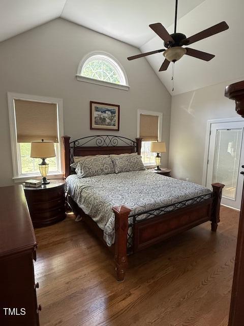 bedroom featuring vaulted ceiling, dark wood finished floors, and ceiling fan