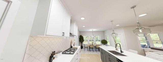 1891 Ballard Rd Unit 192, Fuquay Varina, NC 27526 - kitchen with a sink, recessed lighting, stainless steel gas stovetop, white cabinetry, and light countertops