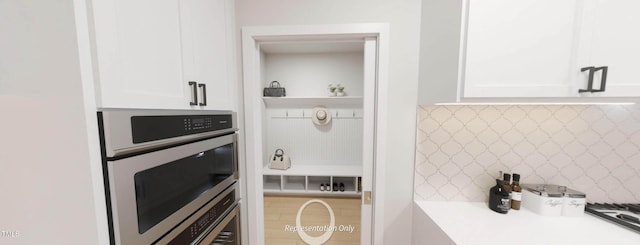 1891 Ballard Rd Unit 192, Fuquay Varina, NC 27526 - kitchen with stainless steel oven, white cabinets, and light countertops
