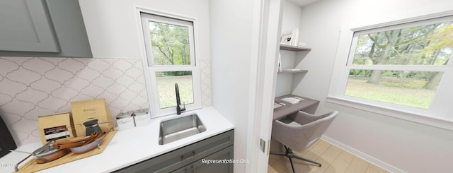 1891 Ballard Rd Unit 192, Fuquay Varina, NC 27526 - kitchen with gray cabinets, a sink, a desk, and healthy amount of natural light