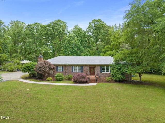 1514 Lawrence Rd, Creedmoor, NC 27522 - single story home with a front yard, a chimney, and brick siding