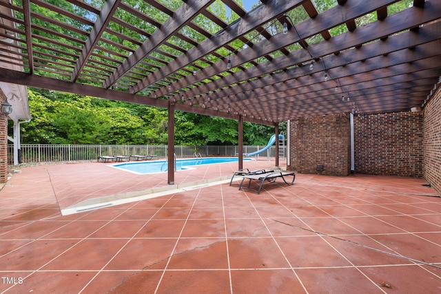 1514 Lawrence Rd, Creedmoor, NC 27522 - view of swimming pool with a water slide and a pergola