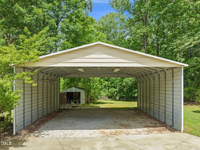 1514 Lawrence Rd, Creedmoor, NC 27522 - view of parking / parking lot featuring a carport and view of wooded area