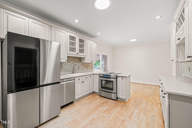 1514 Lawrence Rd, Creedmoor, NC 27522 - kitchen with stainless steel appliances, a sink, decorative backsplash, a peninsula, and light countertops