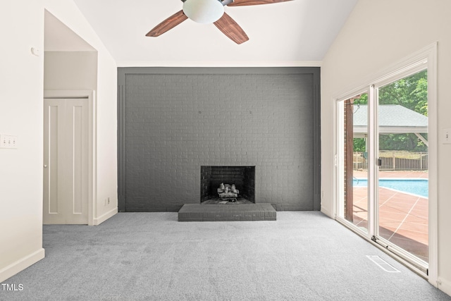 1514 Lawrence Rd, Creedmoor, NC 27522 - carpeted living area featuring ceiling fan, vaulted ceiling, a brick fireplace, and baseboards