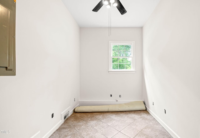 1514 Lawrence Rd, Creedmoor, NC 27522 - spare room with baseboards, a ceiling fan, electric panel, and light tile patterned floors
