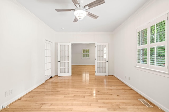 1514 Lawrence Rd, Creedmoor, NC 27522 - unfurnished room featuring french doors, crown molding, wood finished floors, baseboards, and a ceiling fan
