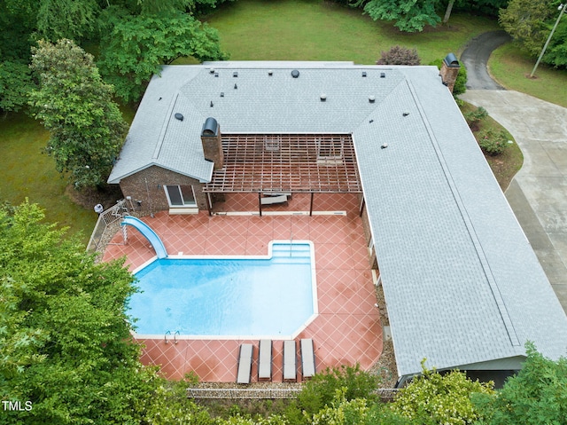 1514 Lawrence Rd, Creedmoor, NC 27522 - outdoor pool with a patio area, a water slide, and a lawn