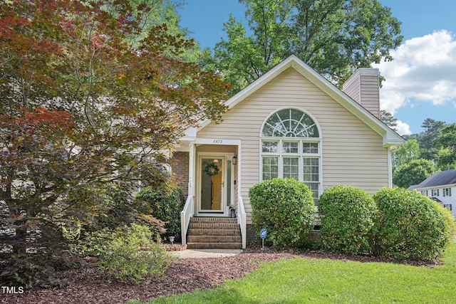 1102 Laurens Way, Knightdale, NC 27545 - view of front facade with a chimney, entry steps, and a front yard