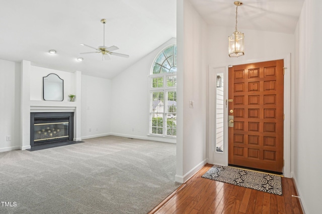 1102 Laurens Way, Knightdale, NC 27545 - foyer entrance with ceiling fan, high vaulted ceiling, hardwood / wood-style flooring, baseboards, and a fireplace with flush hearth