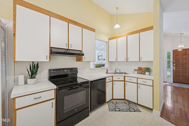 1102 Laurens Way, Knightdale, NC 27545 - kitchen featuring under cabinet range hood, black appliances, a sink, and light countertops