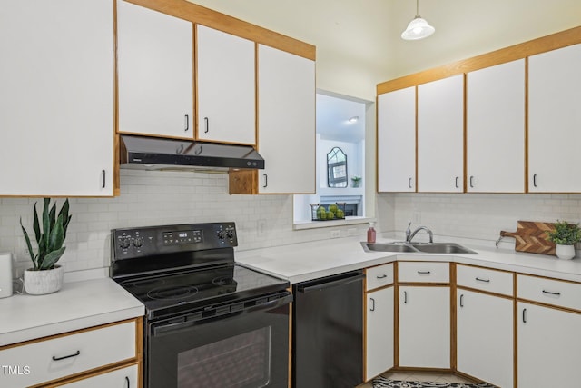 1102 Laurens Way, Knightdale, NC 27545 - kitchen with electric range, under cabinet range hood, a sink, dishwashing machine, and light countertops