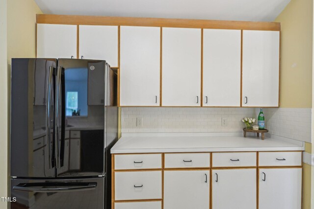 1102 Laurens Way, Knightdale, NC 27545 - kitchen featuring freestanding refrigerator, light countertops, decorative backsplash, and white cabinets