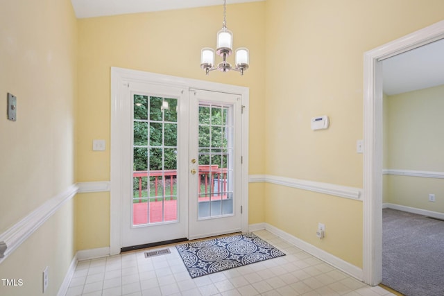 1102 Laurens Way, Knightdale, NC 27545 - doorway to outside featuring a chandelier, french doors, baseboards, and tile patterned flooring