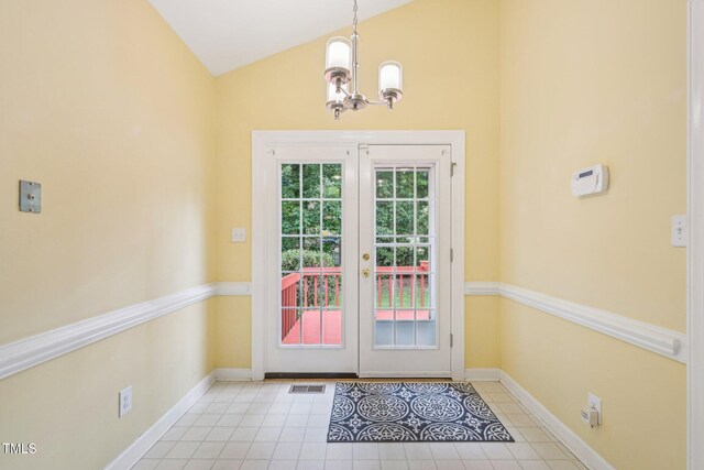 1102 Laurens Way, Knightdale, NC 27545 - doorway to outside featuring french doors, a chandelier, tile patterned flooring, baseboards, and high vaulted ceiling