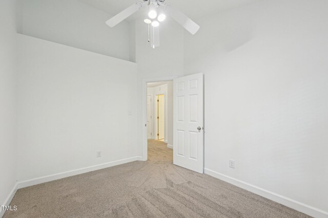 1102 Laurens Way, Knightdale, NC 27545 - carpeted empty room featuring baseboards, ceiling fan, and high vaulted ceiling