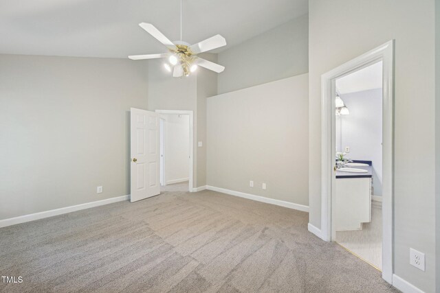 1102 Laurens Way, Knightdale, NC 27545 - unfurnished bedroom with carpet, baseboards, a ceiling fan, and vaulted ceiling