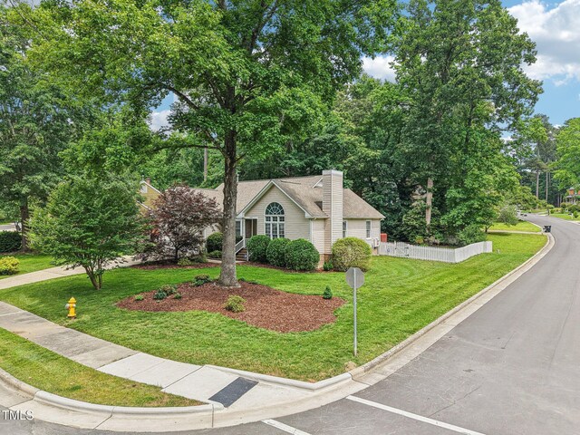 1102 Laurens Way, Knightdale, NC 27545 - view of front facade with a front yard and a chimney
