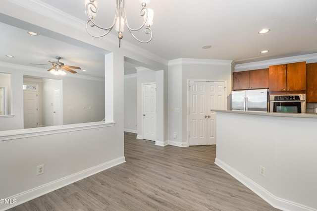 unfurnished living room with crown molding, recessed lighting, ceiling fan, light wood-style flooring, and baseboards