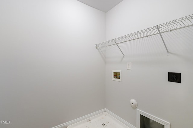 washroom with hookup for a gas dryer, hookup for a washing machine, electric dryer hookup, and baseboards