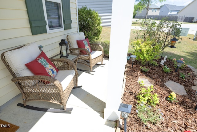 view of patio featuring fence