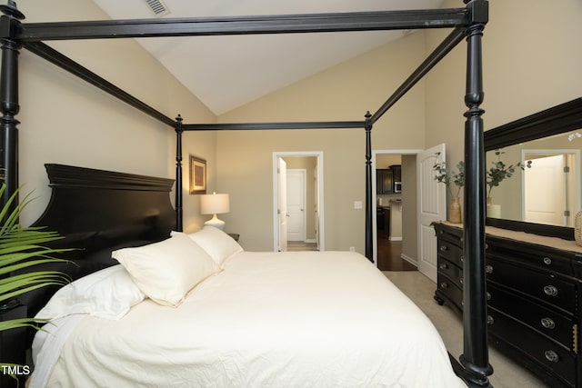 bedroom featuring lofted ceiling, carpet floors, and baseboards