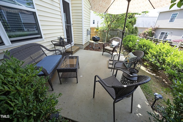 view of patio featuring fence