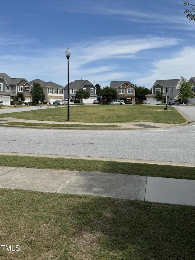 1940 Dunfield Dr, Fuquay Varina, NC 27526 - view of asphalt road featuring sidewalks and a residential view