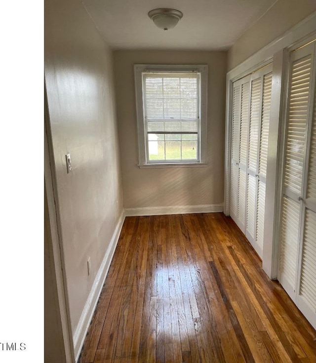 1609 Main St, Scotland Neck, NC 27874 - unfurnished bedroom with hardwood / wood-style floors and baseboards