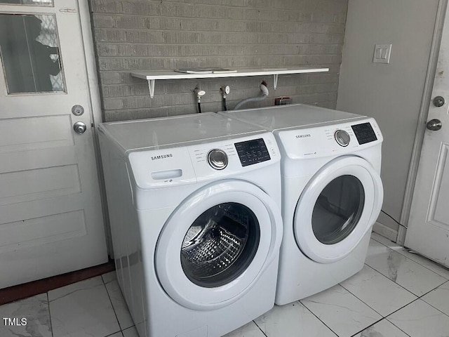 1609 Main St, Scotland Neck, NC 27874 - washroom featuring light marble finish floors and separate washer and dryer