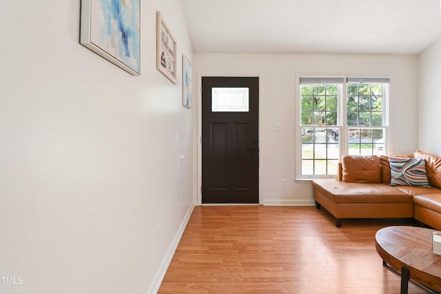 1508 Malta Ave, Raleigh, NC 27610 - entryway with light wood-style flooring and baseboards