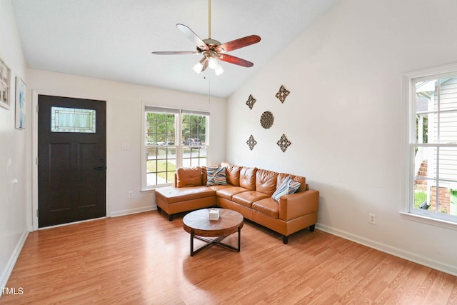 1508 Malta Ave, Raleigh, NC 27610 - living room with vaulted ceiling, light wood-style flooring, ceiling fan, and baseboards