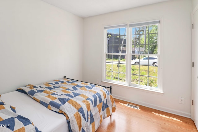 1508 Malta Ave, Raleigh, NC 27610 - bedroom with baseboards and wood finished floors