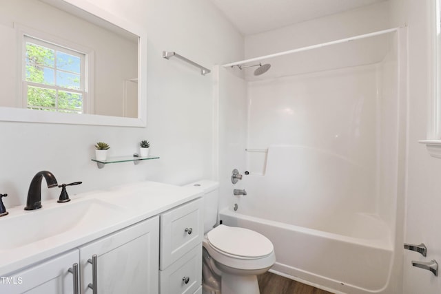 1508 Malta Ave, Raleigh, NC 27610 - bathroom with toilet, vanity, shower / bathtub combination, and wood finished floors