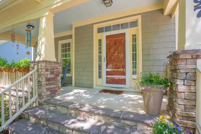 doorway to property featuring a porch