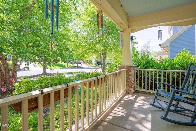 balcony featuring a porch