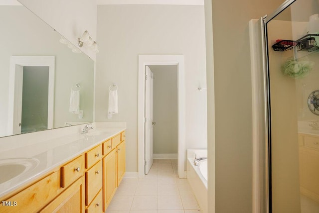 full bath with tile patterned floors, a shower stall, a garden tub, and double vanity