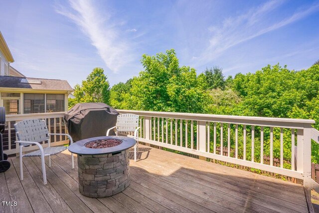 deck featuring a fire pit