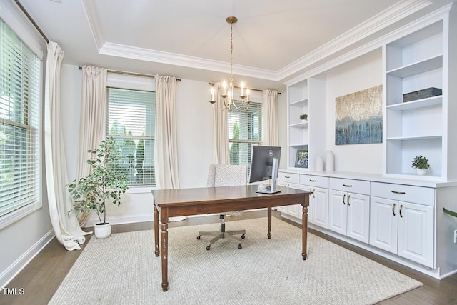 office space with a chandelier, healthy amount of natural light, baseboards, crown molding, and dark wood-style flooring