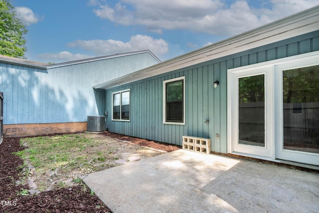 back of house with a patio and cooling unit