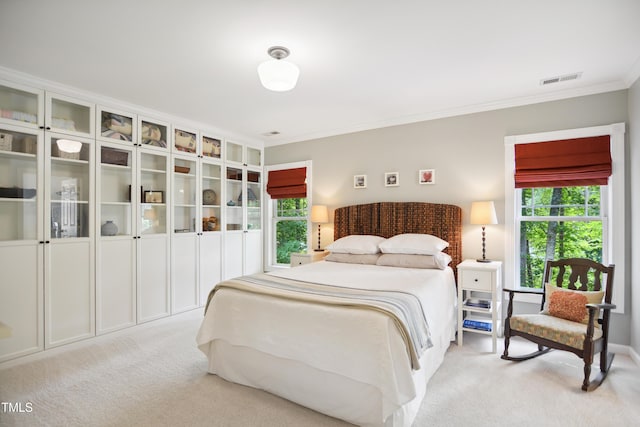 bedroom featuring light carpet and ornamental molding