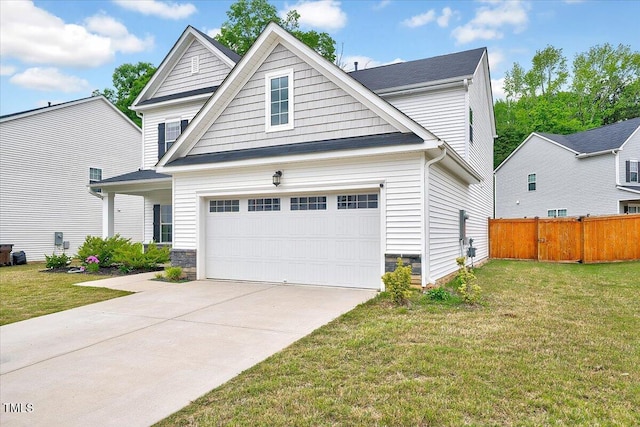traditional-style home with a garage, concrete driveway, and stone siding