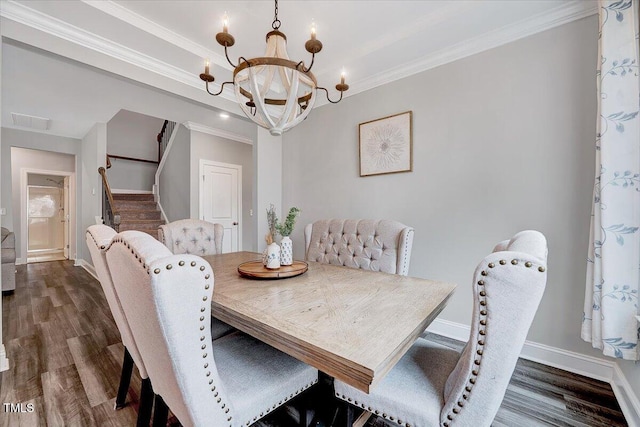 dining area featuring a chandelier, ornamental molding, dark wood-style flooring, stairway, and baseboards