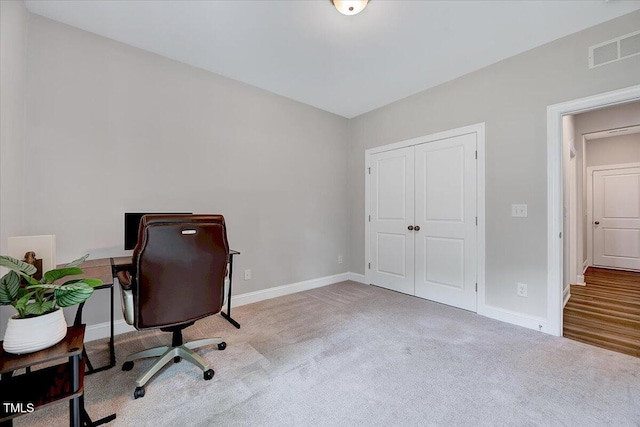 office space featuring carpet and baseboards