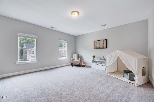 sitting room with carpet and baseboards