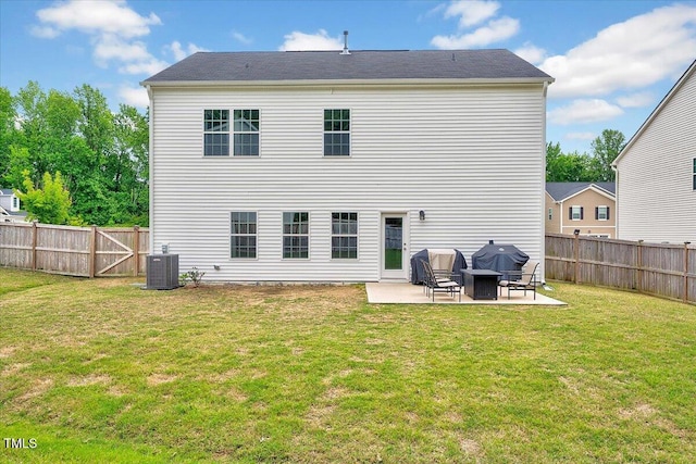 rear view of house with a patio and central AC unit