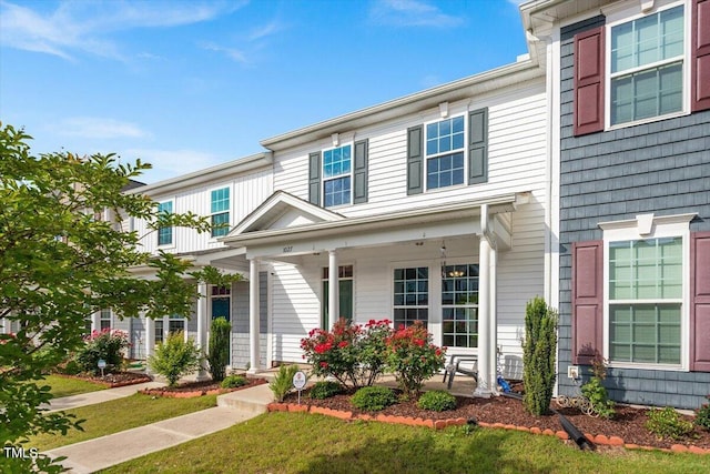 1027 Myers Point Dr, Morrisville, NC 27560 - view of front of home featuring a porch and a front lawn