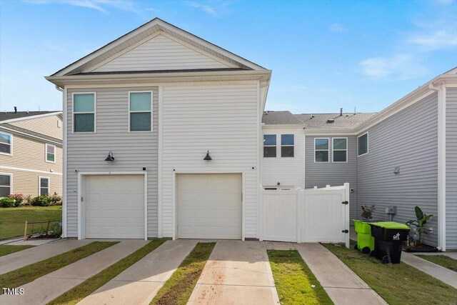 1027 Myers Point Dr, Morrisville, NC 27560 - view of front of house with a garage, driveway, and fence