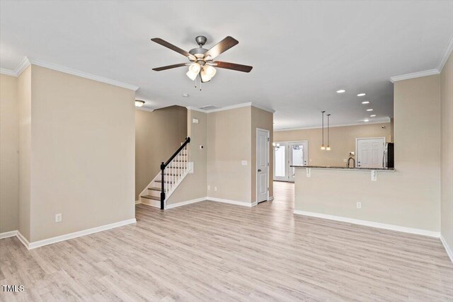 1027 Myers Point Dr, Morrisville, NC 27560 - unfurnished living room with light wood-style flooring, ornamental molding, ceiling fan, baseboards, and stairway
