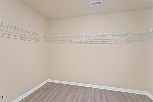 1027 Myers Point Dr, Morrisville, NC 27560 - walk in closet featuring wood finished floors